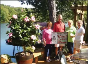  ?? Submitted photo ?? LUSH LANDSCAPE: The yard of Polly and Bob Revell has been recognized as the September Yard of the Month. Above, the Revells are with Master Gardeners Carolyn Davis and Linda Doherty. Not pictured are Barbara Bradstreet and Jane Oliver.