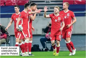  ??  ?? Kamil Jozwiak celebrates his goal for Poland.