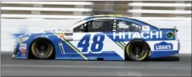  ?? LARRY PAPKE — THE ASSOCIATED PRESS ?? Jimmie Johnson heads down the front stretch during practice at Texas Motor Speedway.