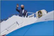  ?? PATRICK SEMANSKY — THE ASSOCIATED PRESS ?? President Joe Biden waves as he boards Air Force One at Andrews Air Force Base, Md., on Friday. Biden is spending the weekend at his home in Delaware.