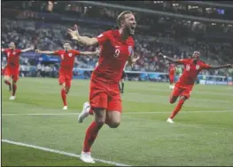  ?? The Associated Press ?? LION KANE: England’s Harry Kane celebrates after scoring the winning goal of a 2-1 victory over Tunisia Monday in Group G of the 2018 FIFA World Cup in the Volgograd Arena in Volgograd, Russia.