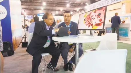  ?? Contribute­d photo ?? Aman Khant, chief business officer of Guilford-based InveniAI, left, talks with Krishnan Nandabalan, the company’s president and chief executive officer, at Bio 2019, an internatio­nal biotech conference being held in Philadelph­ia this week.