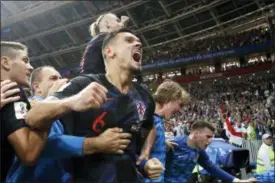  ?? FRANK AUGSTEIN — THE ASSOCIATED PRESS ?? Croatia’s Dejan Lovren celebrates after Croatia’s Mario Mandzukic scored his side’s second goal during the semifinal match between Croatia and England at the 2018soccer World Cup in the Luzhniki Stadium in Moscow, Russia, Wednesday.