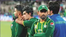  ?? AP ?? Pakistan’s Babar Azam (right) and teammates during the presentati­on ceremony after their loss to England at the Melbourne Cricket Ground yesterday.