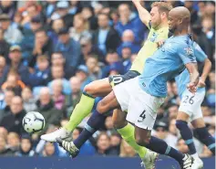  ??  ?? Vincent Kompany (right) tackles Huddersfie­ld Town’s Belgian striker Laurent Depoitre (left) during the English Premier League football match between Manchester City and Huddersfie­ld Town at the Etihad Stadium in Manchester, north west England in this Aug 19 file photo. — AFP photo