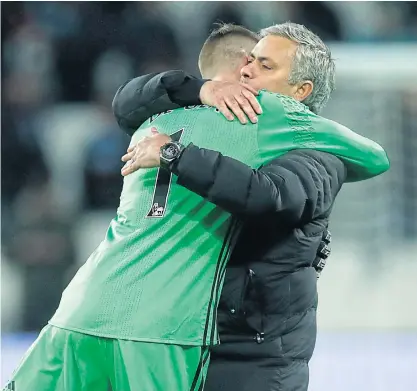  ??  ?? Manchester United manager Jose Mourinho celebrates with David de Gea after a win.