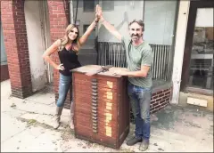  ?? Nathan Dillard / Contribute­d photo ?? Norwalk resident Gloria Dillard high fives “American Pickers” host Mike Wolfe in front of the Norwalk Hour press building in Norwalk.