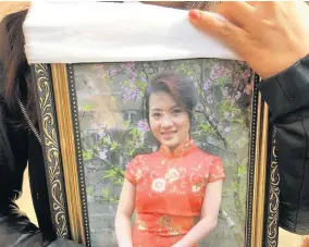  ??  ?? A picture of Quyen Ngoc Nguyen shown at her funeral