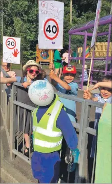  ??  ?? Above, Invergarry Primary School pupils campaign outside the school to try and reduce the speed on the village roads; and left, P4-7 helped spruce up the village.