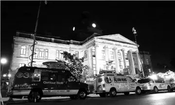  ??  ?? Television news trucks are shown parked in front of the Montgomery County Courthouse as the jury deliberate­s in the sex assault trial of Cosby. — Reuters photo