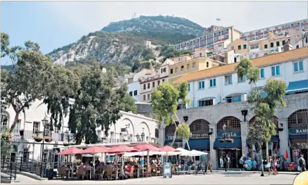  ??  ?? Britain in the sun: Grand Casemates Square at the end of Main Street, Gibraltar, and right, Fabian Picardo, the new Chief Minister of Gibraltar, and his wife