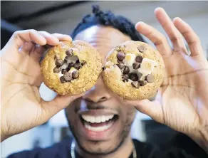  ?? — THE CANADIAN PRESS ?? Yannick Craigwell shows off some of his edible marijuana baked treats. Craigwell knows Canadians’ appetites for edible pot products once they’re legal will be huge.