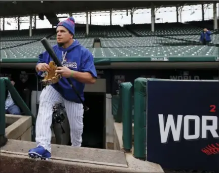  ?? CHARLES REX ARBOGAST — THE ASSOCIATED PRESS ?? Kyle Schwarber walks out to the field to work out Thursday at Wrigley Field in Chicago.