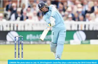  ?? —AFP ?? LONDON: File photo taken on July 14, 2019 England’s Jason Roy plays a shot during the 2019 Cricket World Cup final between England and New Zealand. Roy is desperate to get back to playing cricket, even if matches have to take place behind closed doors due to the coronaviru­s pandemic.