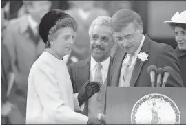 ?? STEVE HELBER — THE ASSOCIATED PRESS ?? Virginia Gov. Gerald Baliles, right, shares the podium with Virginia Lt. Gov. L. Douglas Wilder, center, and Attorney General Mary Sue Terry, left, after the three were sworn in at the Capitol in Richmond, Va., in January 1986.