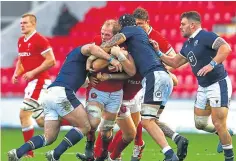  ??  ?? Scotland’s defence repels an Alun Wyn Jones break.