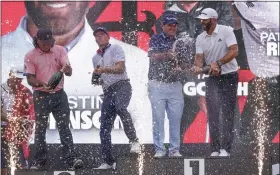  ?? SETH WENIG — THE ASSOCIATED PRESS ?? The 4Aces team celebrates after winning the LIV team competitio­n July 31in Bedminster, N.J. Left to right, Pat Perez, Talor Gooch, Patrick Reed and Dustin Johnson.