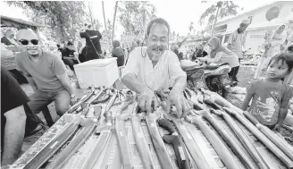  ??  ?? Md Nor selling cleavers of various sizes and shapes at his stall. — Bernama photos