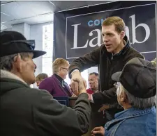  ?? AP ?? LEFT: Conor Lamb, the Democratic congressio­nal candidate in Pennsylvan­ia’s 18th District, greets supporters after speaking to the United Mine Workers of America on Sunday. GETTY IMAGES RIGHT: Republican Rick Saccone talks with supporters at a campaign rally last week in Waynesburg, Pa. Saccone and Lamb are running in a special election being held today in the congressio­nal district being vacated by Republican Tim Murphy.