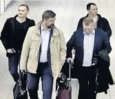  ??  ?? CYBER ATTACK Gang seen on CCTV at airport