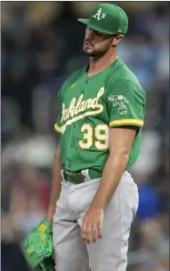  ?? Mercurynew­s.com/sports. ABBIE PARR— THE ASSOCIATED PRESS ?? A's pitcher Kyle Muller is downcast after giving up a two-run home run by the Twins' Ryan Jeffers in the sixth inning. For details and more on the A's result, go to