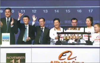  ?? WEI XIAOHAO / CHINA DAILY ?? President of the New York Stock Exchange Tom Farley (far left) stands beside Jack Ma, Alibaba’s executive chairman, as the bell is rung to start Singles Day, a major online shopping festival, at Beijing’s National Aquatic Center on Oct 11.