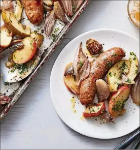  ?? CHRISTOPHE­R TESTANI FOR THE NEW YORK TIMES. FOOD STYLIST: SIMON ANDREWS ?? This recipe for sausages with caramelize­d shallots and apples is sheet-pan cooking at its most successful.