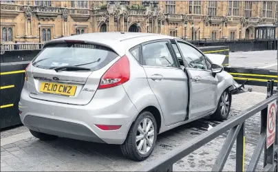  ?? AP PHOTO ?? A handout photo released by the Metropolit­an Police on Wednesday of the silver Ford Fiesta after it crashed outside the Houses of Parliament in a suspected terror attack on Tuesday.