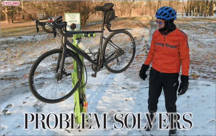  ?? BEN HASTY — READING EAGLE ?? Steve Koch tries putting his bike on a newly installed bicycle repair station on Old Mill Road near the intersecti­on with Old Wyomissing Road in Wyomissing.