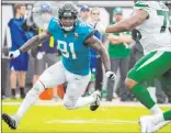  ??  ?? Yannick Ngakoue, playing in 2019 for the Jaguars, has 45½ career sacks, including eight last season while playing with Minnesota and Baltimore. Stephen B. Morton The Associated Press