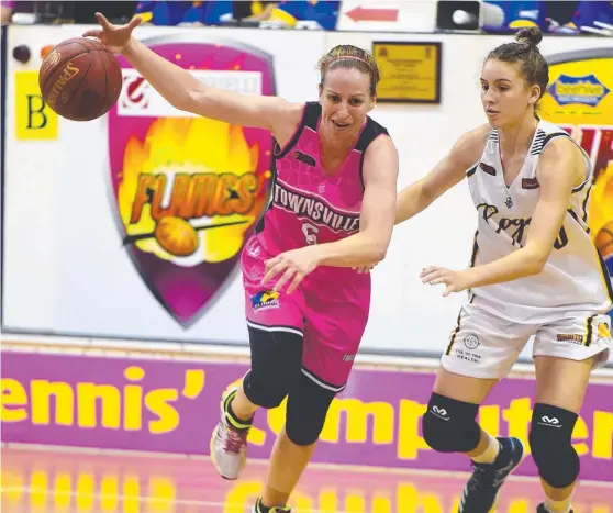  ?? DRIVING FORCE: Rachael McCully in action for the Flames against the Logan Thunder at Townsville Basketball Stadium. Pictures: SCOTT RADFORD- CHISHOLM ??