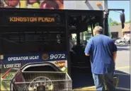  ?? BRIAN HUBERT — DAILY FREEMAN FILE ?? JULY 1: A passenger asks a UCAT bus driver for route informatio­n outside the Hannaford supermarke­t at Kingston Plaza on the first day that UCAT buses operate on former Citibus routes,