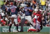  ?? MICHAEL DWYER — THE ASSOCIATED PRESS ?? Minnesota Twins’ Jorge Polanco (11) celebrates his tworun home run behind Boston Red Sox catcher Christian Vazquez that also drove in Gilberto Celestino (67) during the third inning Monday.