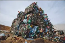  ?? AP PHOTO BY SERGEI GRITS ?? In this March 12, 2015 photo, plastic trash is compacted into bales ready for further processing at the waste processing dump on the outskirts of Minsk, Belarus. A new massive study finds that production of plastic and the hard-to-breakdown synthetic waste is soaring in huge numbers.