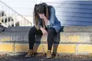  ?? Photograph: Zach Wilkinson/AP ?? University of Idaho student Alaina Tempelis prays on 17 November 2022, in Moscow, Idaho, outside of the home where four fellow students were recently murdered.