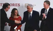  ?? MARCO UGARTE/ASSOCIATED PRESS FILE PHOTO ?? Mexico’s foreign minister Marcelo Ebrard, left, shakes hands with Mexican President Andres Manuel Lopez Obrador as Deputy Prime Minister of Canada Chrystia Freeland, second from left, and U.S. Trade Representa­tive Robert Lighthizer look on during an event in December to sign an update to the North American Free Trade Agreement in Mexico City.