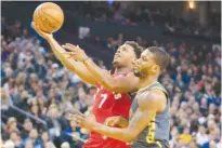  ?? Reuters ?? Toronto Raptors’ Kyle Lowry (7) shoots against Golden State Warriors’ Alfonzo Mckinnie (28) during their NBA game at the Oracle Arena in Oakland on Wednesday.