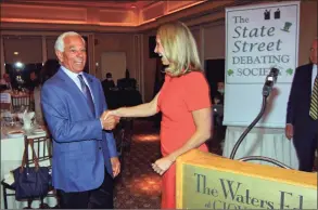  ?? Christian Abraham / Hearst Connecticu­t Media ?? The State Street Debating Society arranges a greeting between Bobby Valentine, who is running unaffiliat­ed, at left, and Caroline Simmons, the Democratic candidate, before the start of the first Stamford mayoral candidate debate at The Waters Edge at Giovanni’s in Darien on Tuesday.