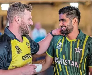  ?? Picture: DANIEL POCKETT ?? BEFORE THE STORM: Aaron Finch of Australia, left, and Babar Azam of Pakistan chat ahead of the ICC Men’s T20 World Cup in Melbourne, Australia.
