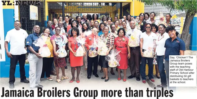  ??  ?? Say, ‘Chicken’! The Jamaica Broilers Group team poses with the teaching staff of Old Harbour Primary School after distributi­ng 50 gift baskets to teachers at the school.