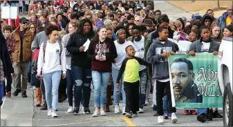  ?? File Photo/DAVID GOTTSCHALK ?? Marchers participat­e in 2017’s annual Martin Luther King Jr. Freedom March to the campus of the University of Arkansas in Fayettevil­le. Activities for the 2018 celebratio­n will begin Jan. 11.