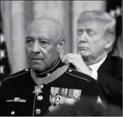  ?? ASSOCIATED PRESS ?? PRESIDENT DONALD TRUMP PRESENTS THE MEDAL OF HONOR TO U.S. MARINE CORPS retired Sgt. Maj. John Canley during an East Room ceremony at the White House in Washington on Wednesday. Canley is the 300th Marine to receive the nation’s highest military medal.