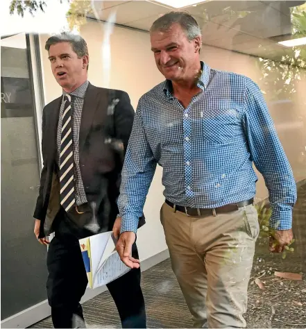  ?? GETTY IMAGES ?? Renowned trainer Darren Weir, right, puts on a brave face as he arrives at the Racing Victoria hearing yesterday where he was disqualifi­ed for four years.