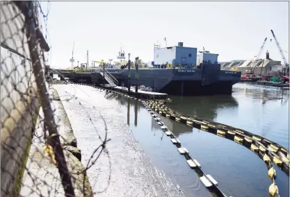  ?? Tyler Sizemore / Hearst Connecticu­t Media ?? A barge is docked in the water beside the Sprague Energy terminal in Stamford on Monday. A developer is looking to rezone Sprague’s two adjoining industrial plots of land at 10 Water St. and 2187 Atlantic St. into a residentia­l high-density parcel. The two parcels of land are on the water adjacent to BLT’s Harbor Point developmen­t.