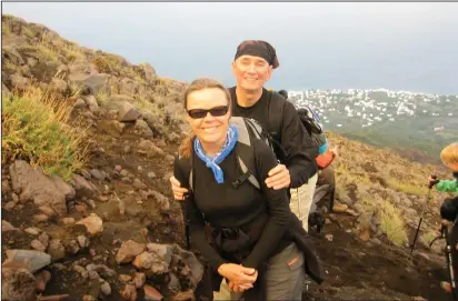  ?? Courtesy of Lynn Peterson Mobley ?? Lynn Peterson Mobley and Robert Wilson Mobley at the beginning of their trek up Italy’s Stromboli volcano in 2010.