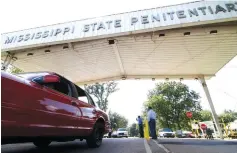  ?? Associated Press ?? ■ Employees leave the front gate of the Mississipp­i State Penitentia­ry on July 21, 2010, in Parchman, Miss. An inmate at the Mississipp­i prison that was a focus of recent deadly unrest was found hanging in his cell by two correction­s officers over the weekend and pronounced dead, a coroner said Sunday.