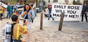  ?? Chalkie Bolton Photograph­y ?? ●●Firefighte­r Joey Hawke completed an epic coast to coast fundraisin­g challenge by proposing to his girlfriend Emily