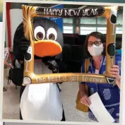  ?? ?? AG Editor-in-chief Chrissie Goldrick dons a mask and poses for a photo before boarding the Qantas flight to Antarctica at Sydney’s domestic terminal on New Year’s Eve 2021.