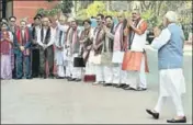  ?? PTI ?? BJP leaders greet Prime Minister Narendra Modi as he arrives to attend the budget session of Parliament on Monday.