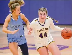  ?? Jim Franco/Times Union ?? Duanesburg’s Alex Moses drives to the basket in front of Columbia defender Kendyl Ouimette. Moses had three points, eight rebounds and nine blocks.